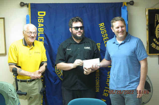PRESENTING A CHECK to Chapter Commander Daniel Diebold is Steve Zimmer on behalf of PMI, Inc. 